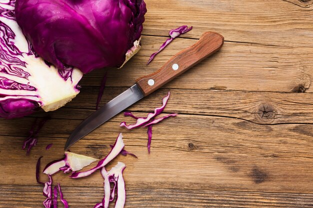 Red onion on wooden background with copy space