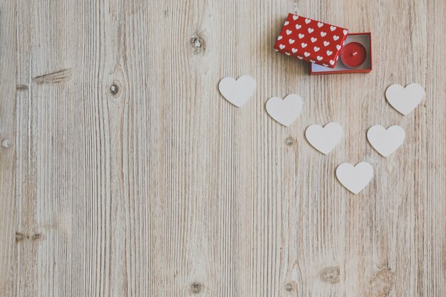 Red open box with white hearts underneath