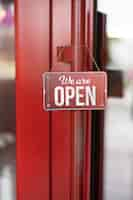 Free photo red open sign hanging