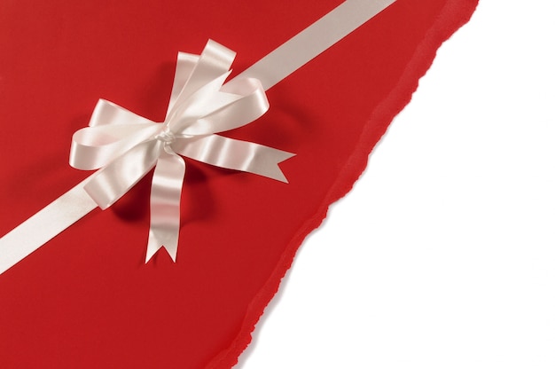 Red paper gift with decorative bow