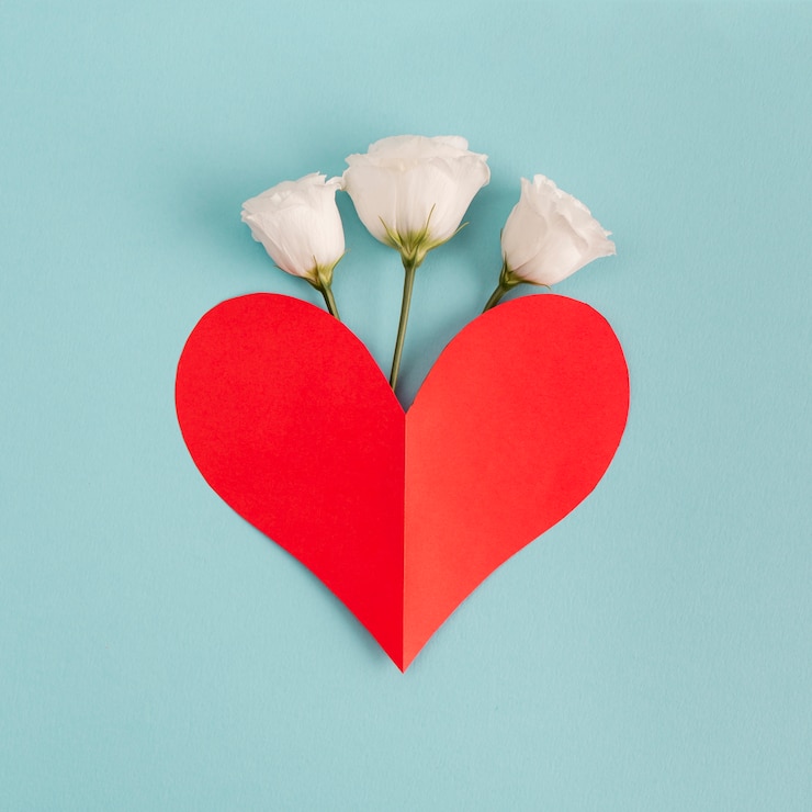 Free Photo red paper heart near fresh flowers