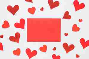 Free photo red paper with bright hearts