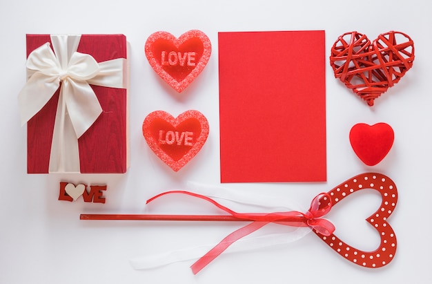 Red paper with different hearts on table