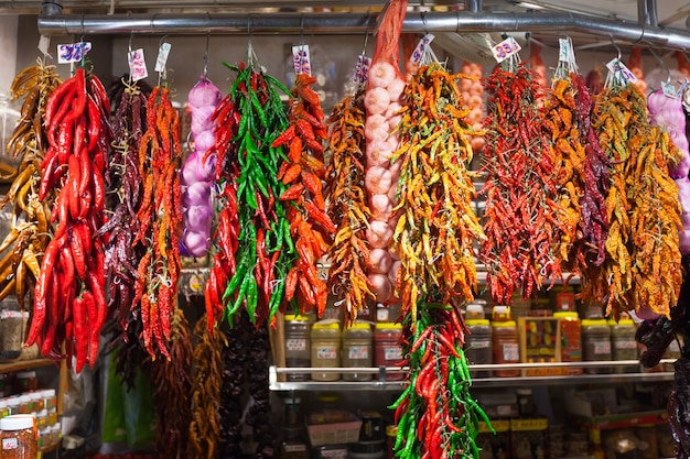 red pepper and garlic hanging in  market