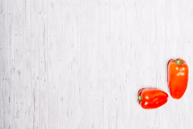 Red peppers on white tabletop