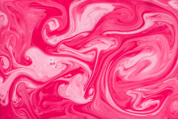 Free photo red and pink marble texture fluid background