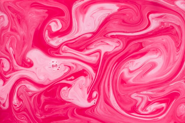 Red and pink marble texture fluid background