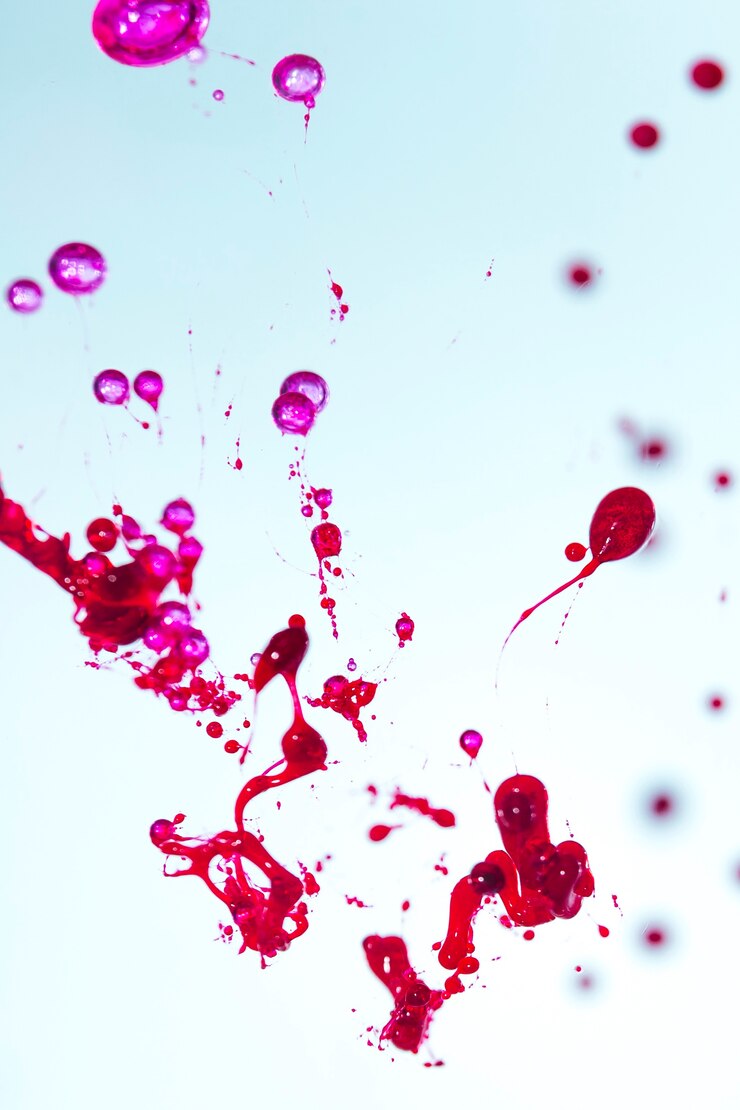 मुफ़्त फोटो red and pink splashes on blue background