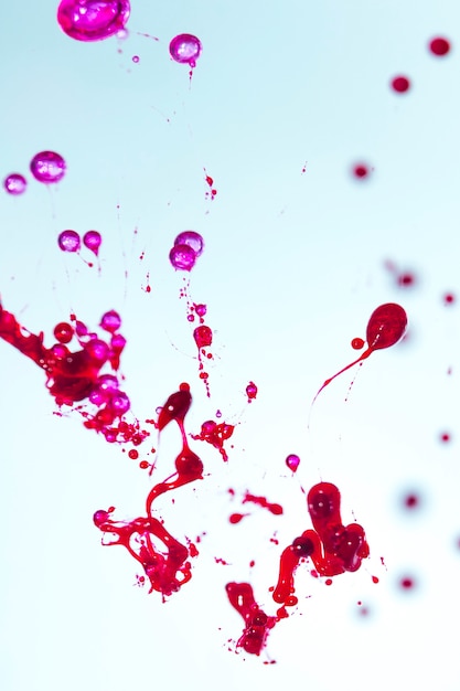 Red and pink splashes on blue background