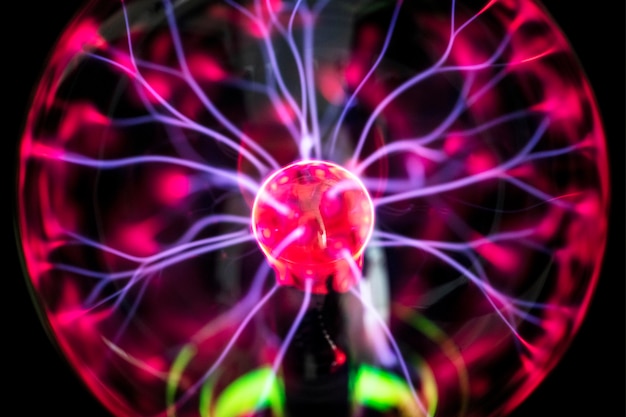 Free photo red plasma ball glowing in the dark wallpaper