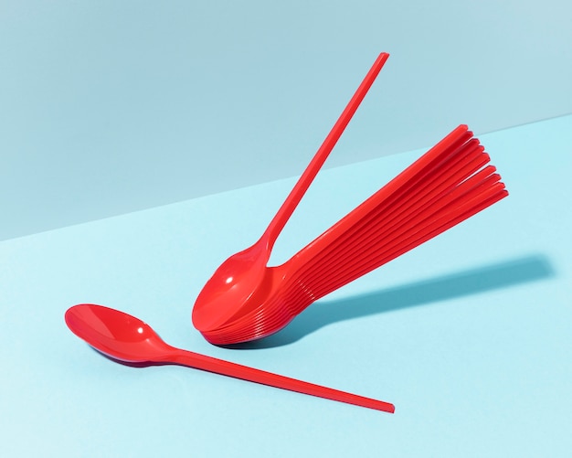 Free photo red plastic spoons high view