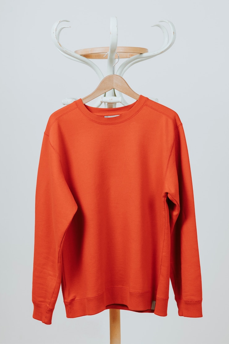 Free Photo red pullover hanging