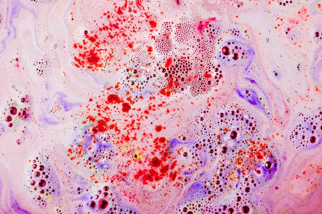 Red and purple textured surface with dissolve bathbomb