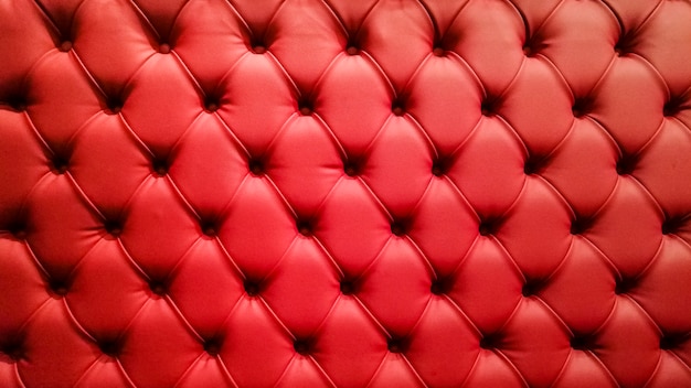 Red quilted sofa background