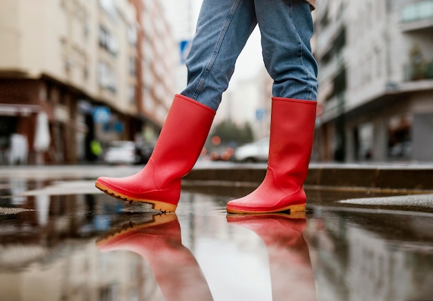 Red rain boots on the street