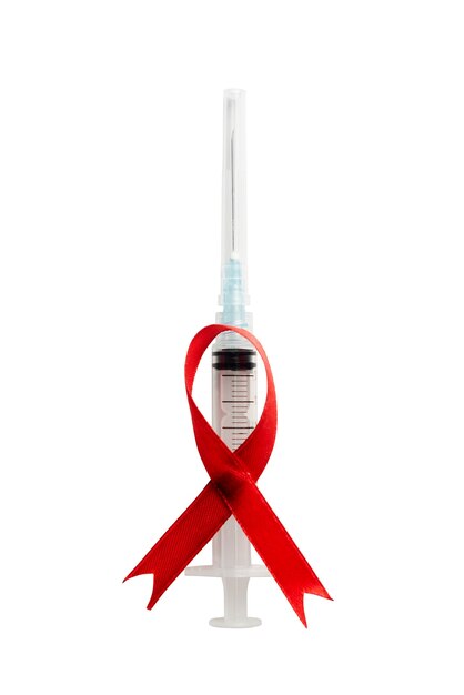 Red ribbon and syringe with white background. Hiv Aids ribbon awareness