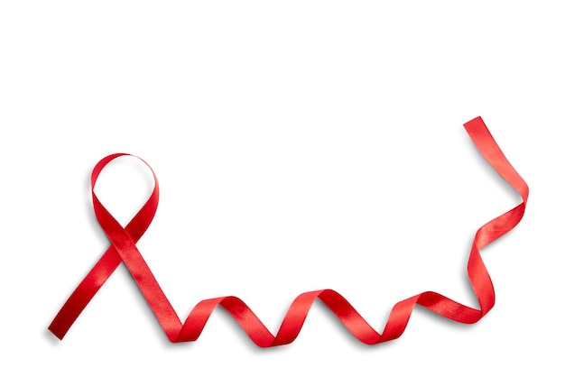 Red ribbon with white background. Hiv Aids ribbon awareness