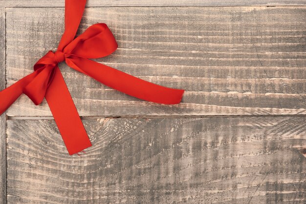 Red ribbon on the wooden planks