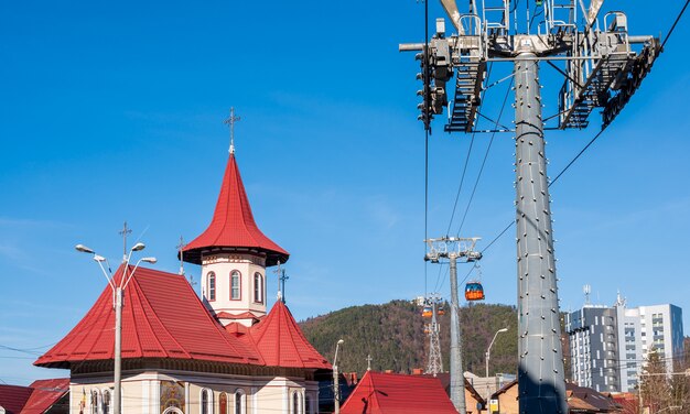 Red roof church and mountain view