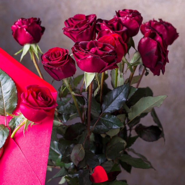 Red rose bouquet on grey background 