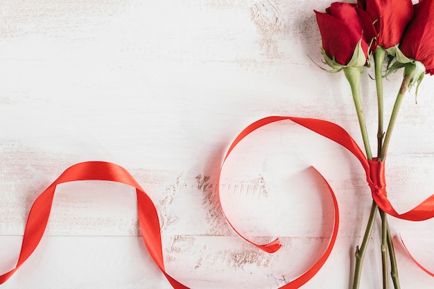 Free photo red roses and red tie