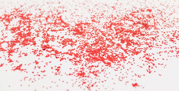 Red scattered confetti on board 