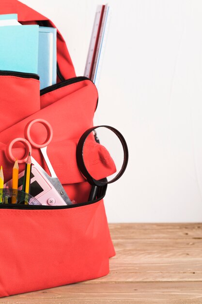 Red school backpack with essential supplies