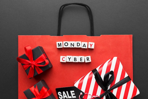 Red shopping bag and cyber monday gifts