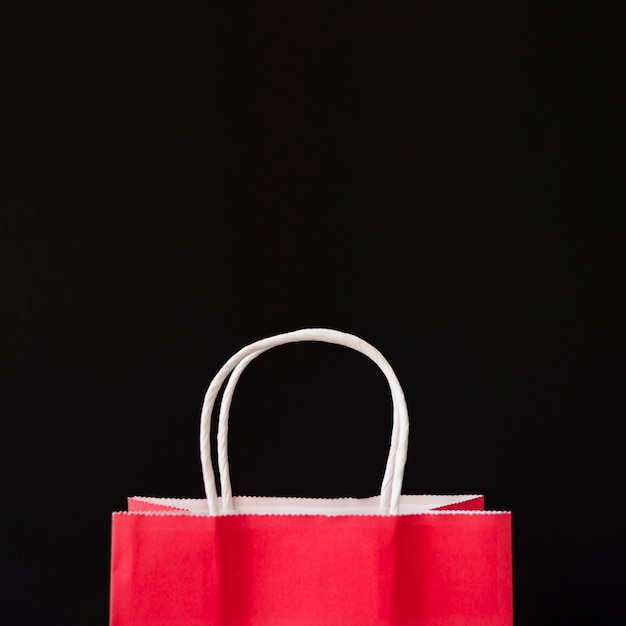 Red shopping bag on table 