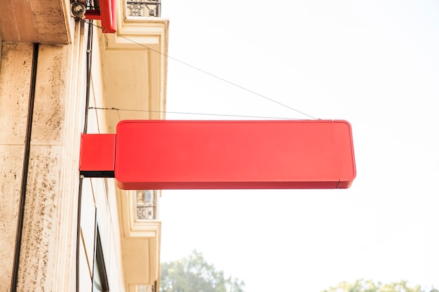 Red sign on wall in city