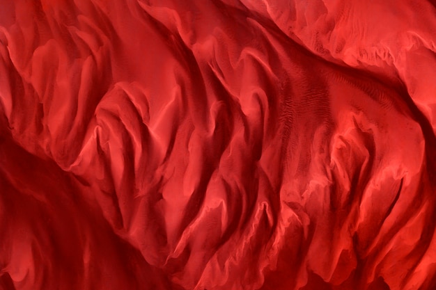 赤い絹の生地の織り目加工の背景