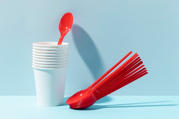 Red small spoons and plastic cups