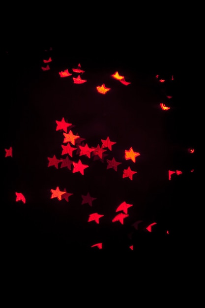 Red stars on black background