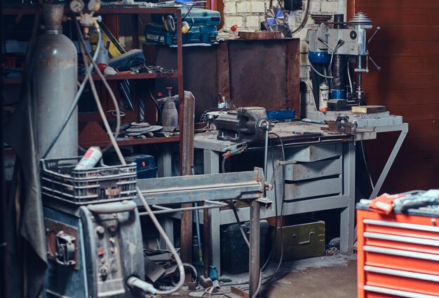 Red steel tool box in a garage.