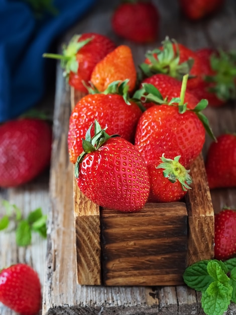 Red strawberries in a wooden box