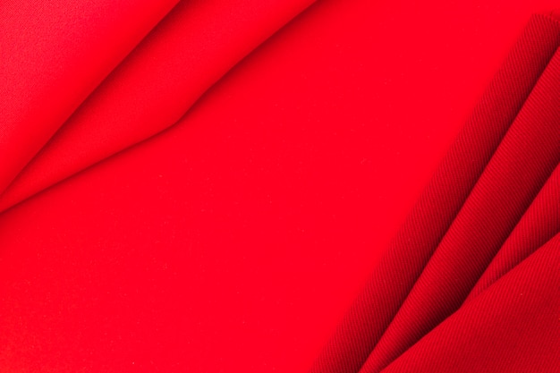Red textile fabric on texture background