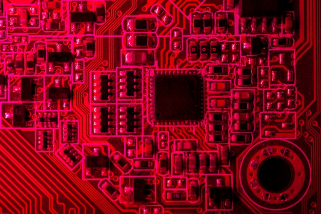 Free photo red themed circuit board with chip close-up