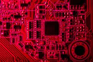 Free photo red themed circuit board with chip close-up