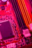 Free photo red themed motherboard with memory slots