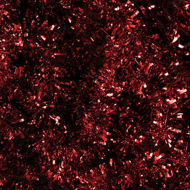 Free photo red tinsel texture close up