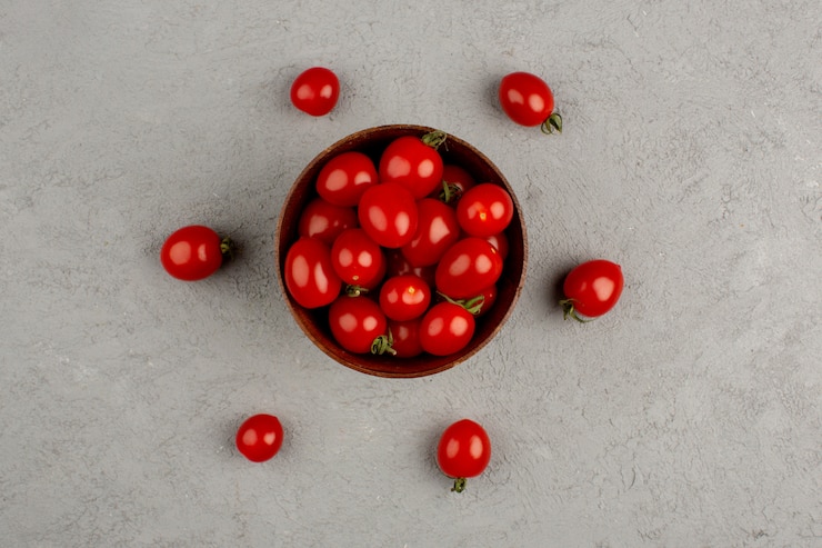 Free Photo red tomatoes ripe fresh vitamine riched inside brown plate on the bright