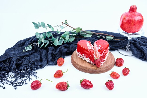 Red valentine cake on a wooden board.