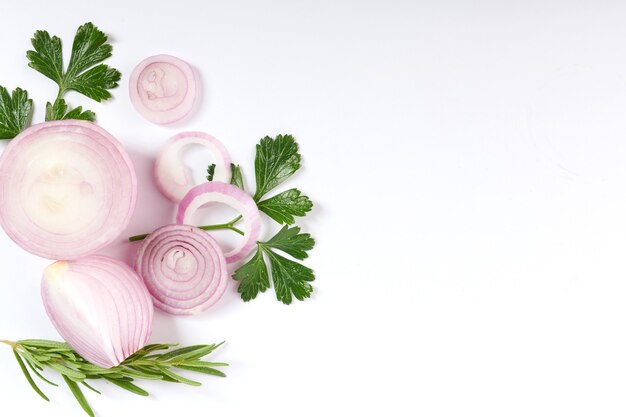 Red whole and sliced onion, Fresh onion isolated on white surface with clipping path. Sliced red onion with parsley on the white.