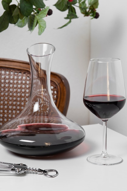 Red wine carafe and glass on table