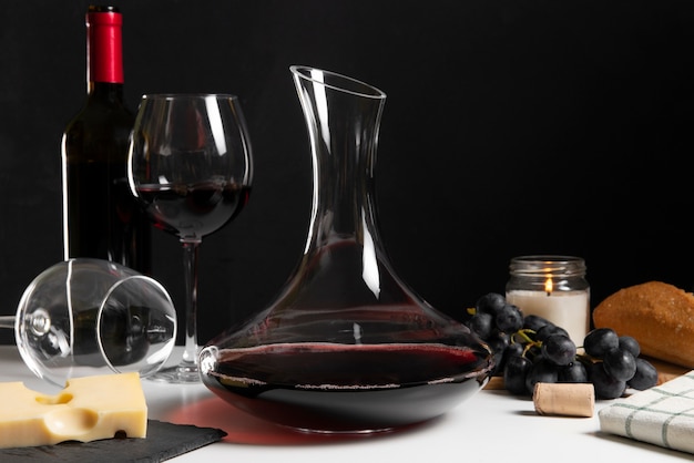 Red wine carafe and snacks on table