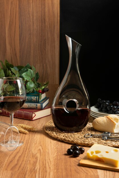 Red wine carafe and snacks on table