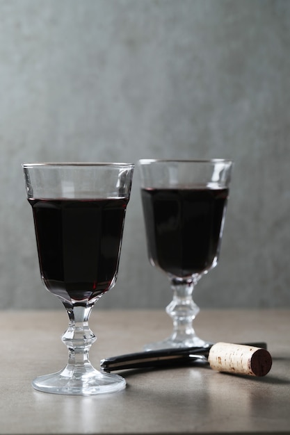 Red wine in glasses and cork
