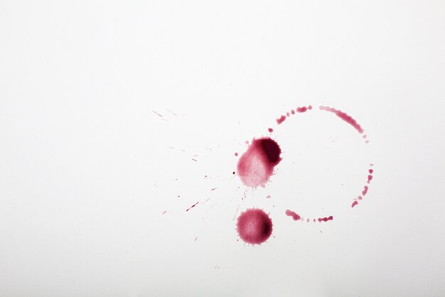 Red wine stains on white textile