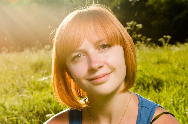 Red woman in warm sunshine