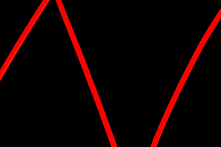 Free Photo red zig zag neon light on black background